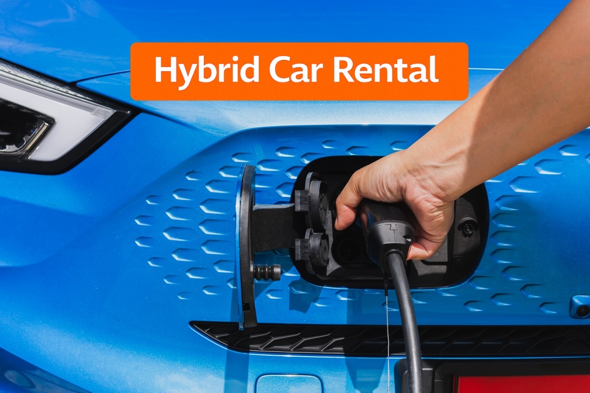 Hybrid Car Rental showing a close-up of a driver plugging a charging cable into a blue hybrid vehicle, highlighting fuel-efficient and eco-friendly transport for affordable long-term car rental.